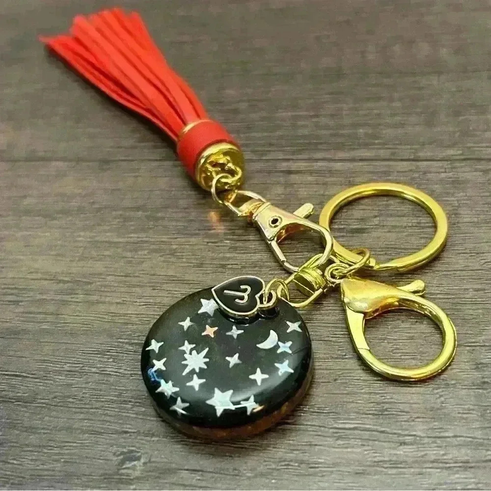 Hand Crafted Medallion Aries Charm and Red Tassel Gold Tone Keychain